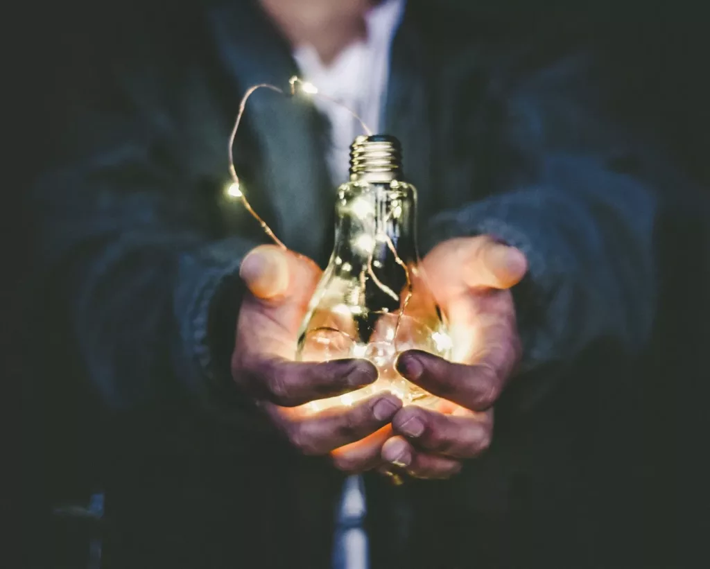 A person holding bulb